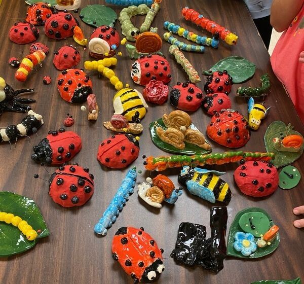 Handmade ceramic ladybug and insect projects created at Siela Summer Camp 2025