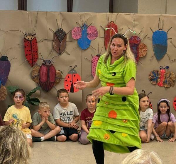 Camp leader leading a ladybug-themed activity with children at Siela Summer Camp 2025